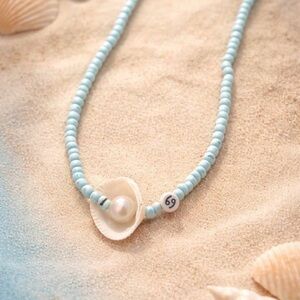 Elegant Blue Beaded Necklace with Shell Pendant